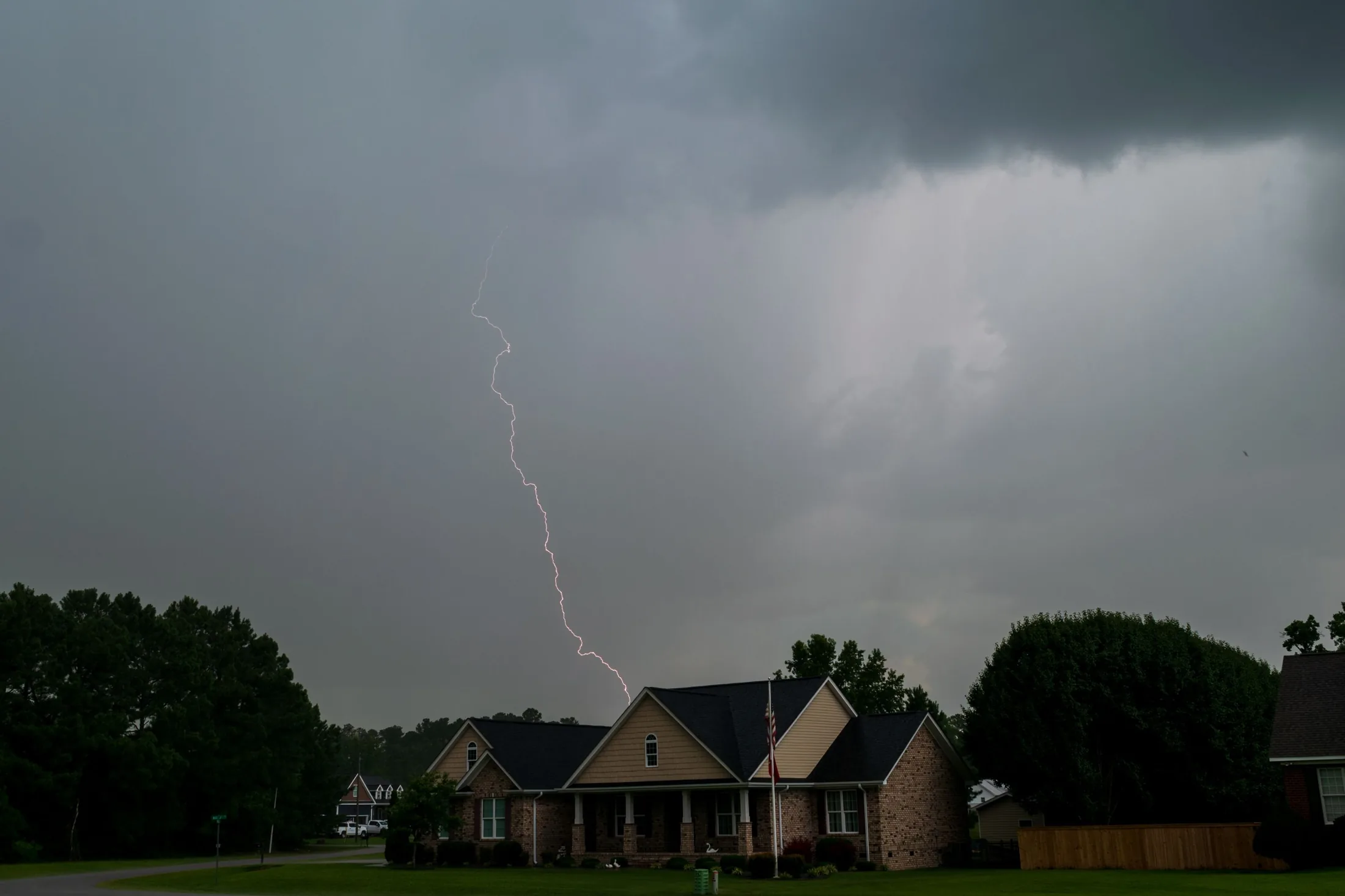 Lightning over a single-story home